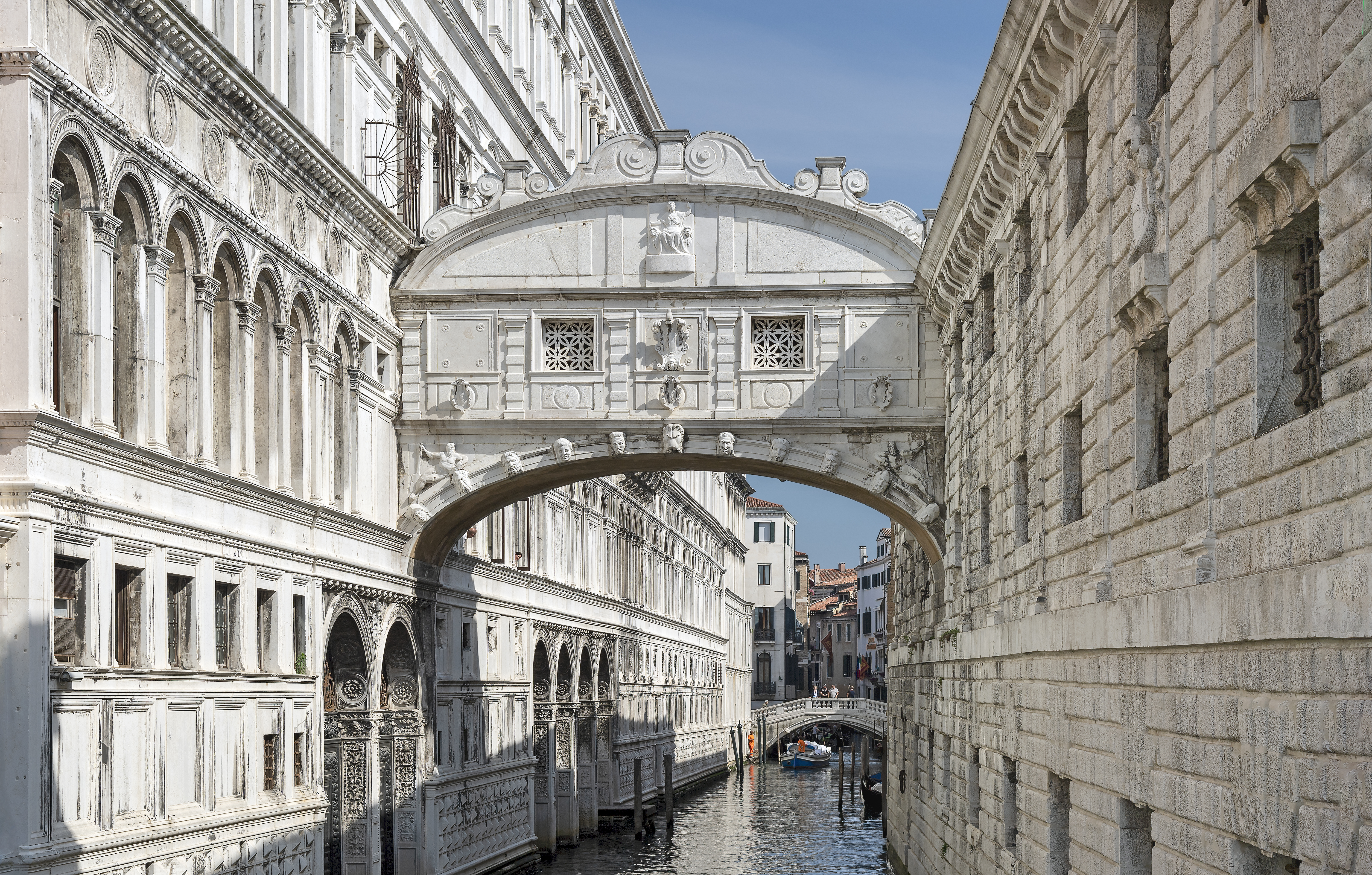 Exterior view of the Bridge of Sighs from the canal, linking the palace and prisons