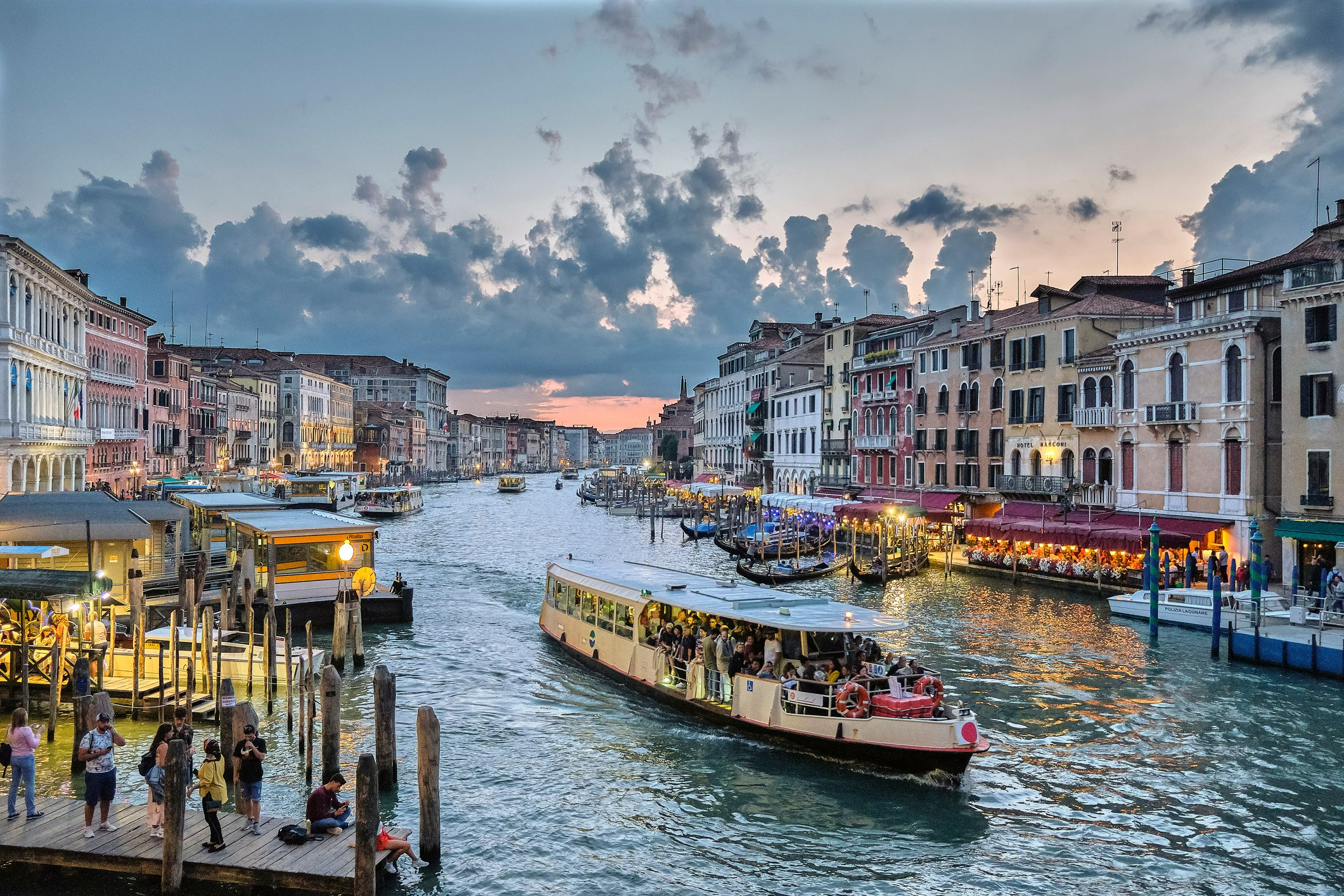 Signs pointing to Piazza San Marco near the lagoon